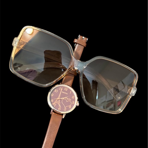 A brown leather strap watch with a heart-shaped dial and sunglasses. main image 4